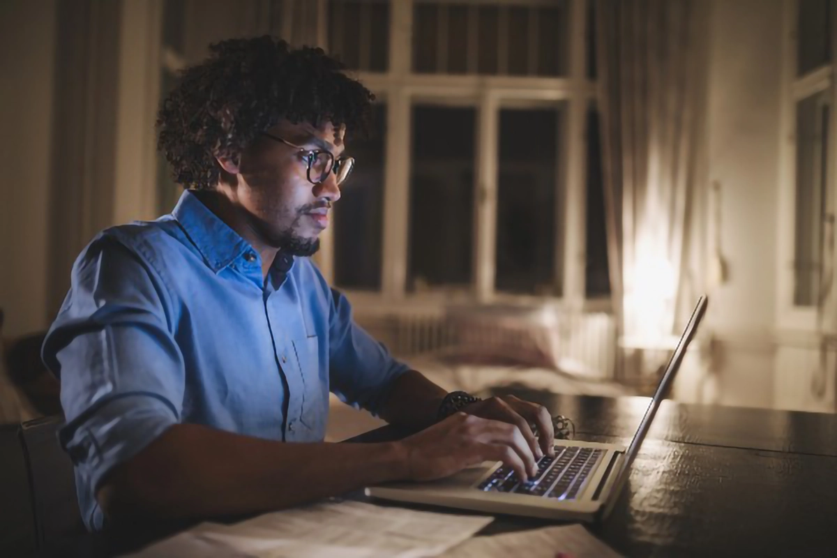 A person looking at a laptop